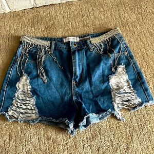 Denim Boulevard frayed cut off shorts with rhinestones at the top front